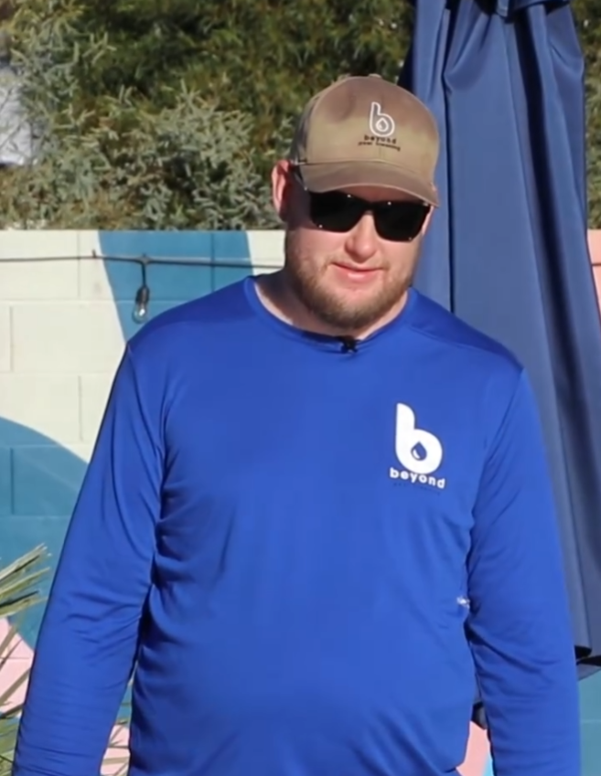 Beyond Pool Cleaning technician in branded gear at a Scottsdale property